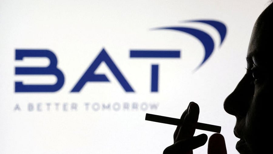 <div class="paragraphs"><p> woman poses with a cigarette in front of BAT (British American Tobacco) logo in this illustration.</p></div>