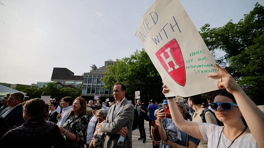 <div class="paragraphs"><p>A person displays a sign as members of the Harvard community take part in a "Harvard Stand United" rally to "support and celebrate" the school's international students at Harvard University.</p></div>