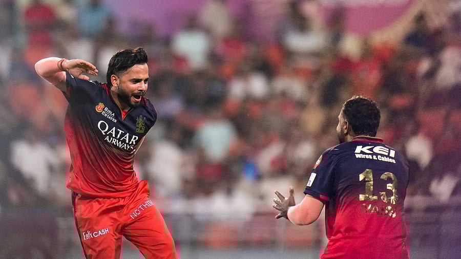 <div class="paragraphs"><p>RCB’s Suyash Sharma (left), who was adjudged the man of the match, celebrates the dismissal of PBKS’ Musheer Khan during Qualifier 1 in Mullanpur on Thursday. </p></div>