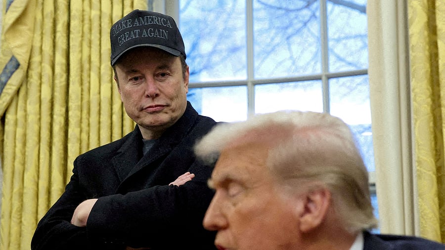 <div class="paragraphs"><p>Elon Musk listens to US President Donald Trump </p></div>