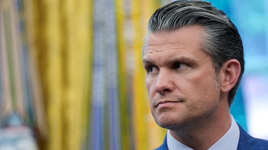 FILE PHOTO: U.S. Defense Secretary Pete Hegseth looks on as he attends the signing of an executive order by U.S. President Donald Trump, at the White House in Washington, D.C., U.S., May 23, 2025. REUTERS/Kent Nishimura/File Photo