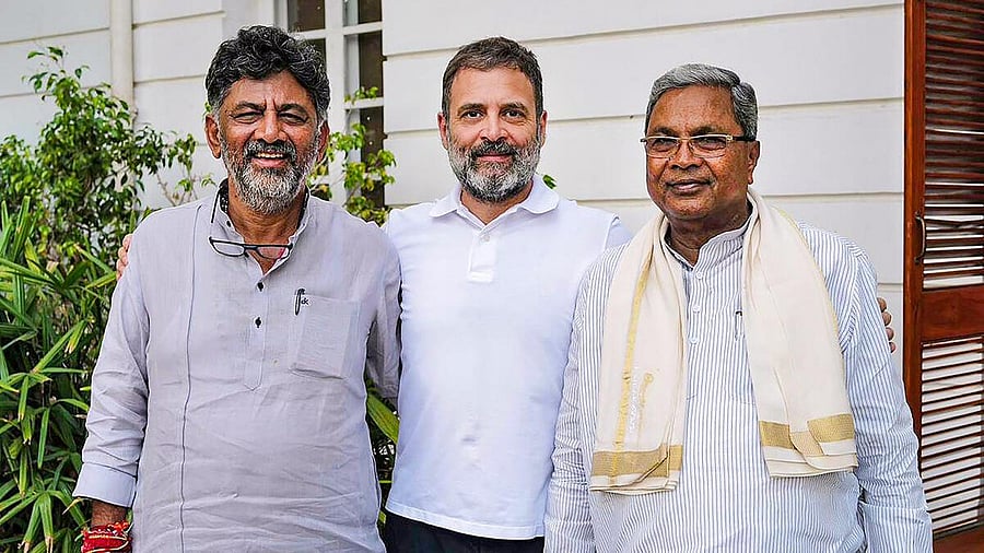 <div class="paragraphs"><p>Karnataka CM Siddaramaiah and Deputy CM D K Shivakumar with Rahul Gandhi.</p></div>