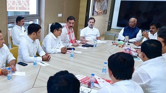 <div class="paragraphs"><p>Rahul Gandhi and Mallikarjun Kharge with Congress leaders in Assam.</p></div>