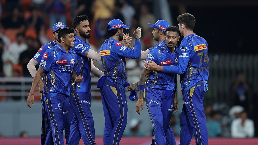 <div class="paragraphs"><p> Mumbai Indians' Ashwani Kumar, Hardik Pandya and teammates celebrate after the match </p></div>