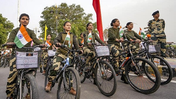<div class="paragraphs"><p>Border Security Force (BSF) personnel ride bicycles during a cycle rally organised at the Attari-Wagah Border, in Amritsar district, Punjab.</p></div>