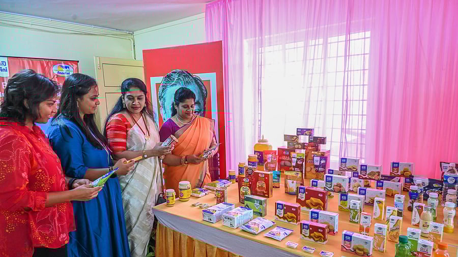 <div class="paragraphs"><p>Women purchase Nandini products at Dairy Circle in Bengaluru on Sunday. </p></div>