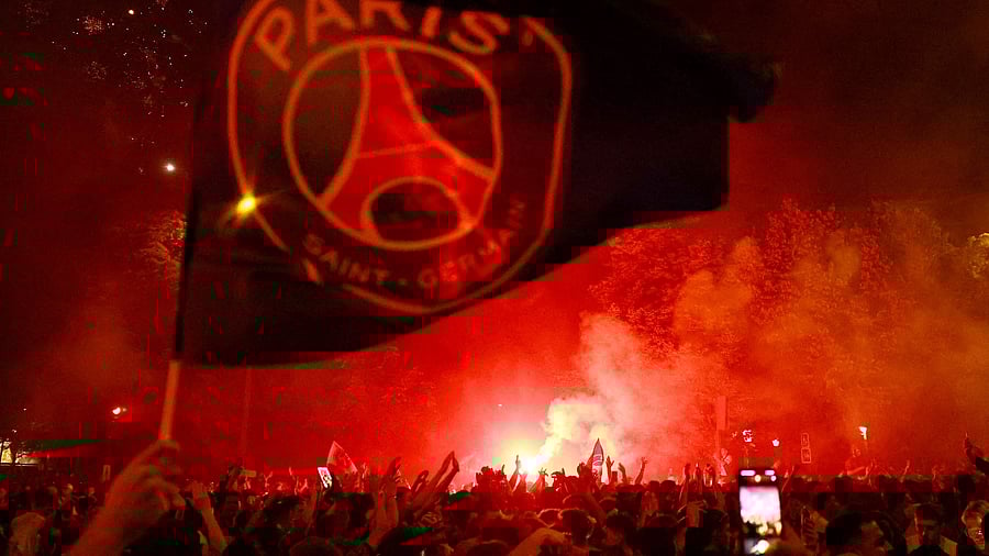 <div class="paragraphs"><p>Paris St Germain fans celebrate with flares at Porte d'Auteuil after winning the Champions League.</p></div>
