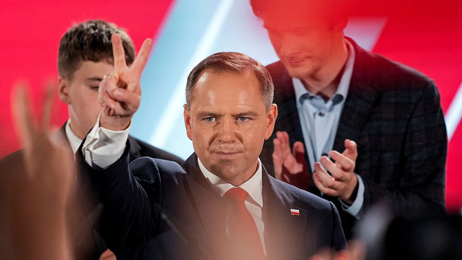 <div class="paragraphs"><p>Polish presidential candidate Karol Nawrocki, backed by the main opposition Law and Justice (PiS) party, reacts to the exit polls of the second round of the presidential election, in Warsaw, Poland, June 1, 2025.</p></div>