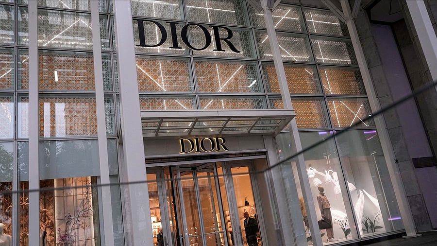 <div class="paragraphs"><p>FILE PHOTO: A security guard looks out from the store of French luxury goods company Dior on 5th Avenue in New York City, US.</p></div>
