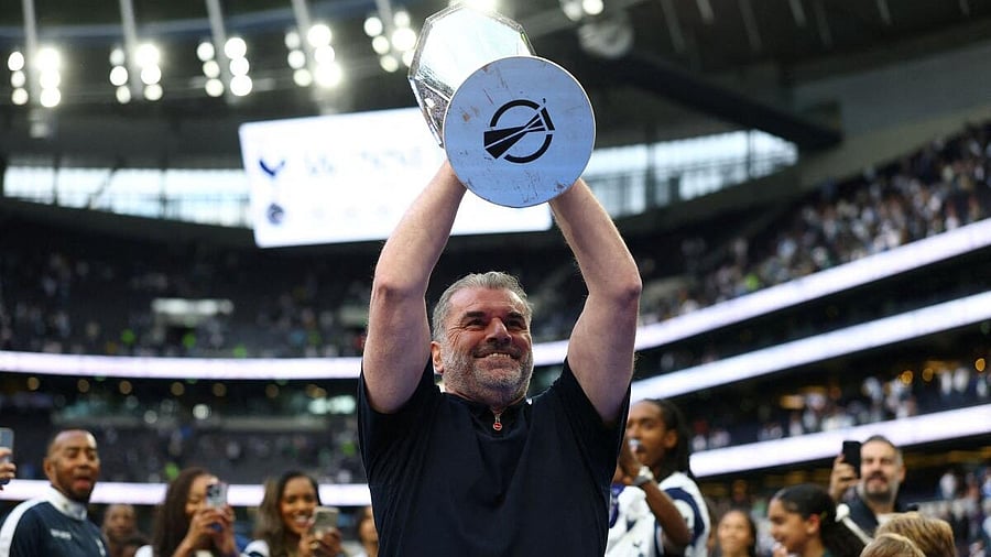 <div class="paragraphs"><p>Tottenham Hotspur manager Ange Postecoglou holds aloft the Europa League trophy.</p></div>
