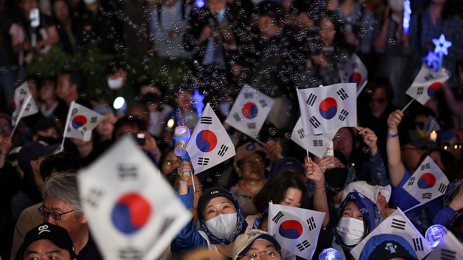 <div class="paragraphs"><p>Supporters wait for Lee Jae-myung, the presidential candidate for South Korea's Democratic Party, on the day of the presidential election, near the National Assembly in Seoul, South Korea, June 3, 2025. </p></div>