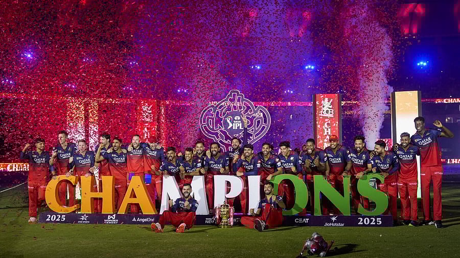 <div class="paragraphs"><p>Royal Challengers Bengaluru’s captain Rajat Patidar, Virat Kohli and others pose for photographers with the championship trophy during the presentation ceremony of the Indian Premier League (IPL) 2025 final, at the Narendra Modi Stadium, in Ahmedabad, Tuesday, June 3, 2025.</p></div>