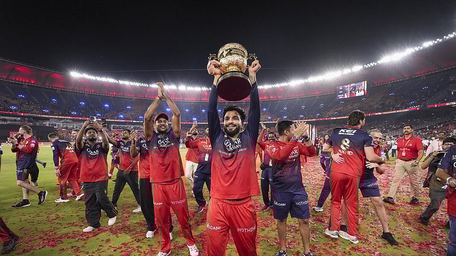 <div class="paragraphs"><p>Royal Challengers Bengaluru’s captain Rajat Patidar holds the Indian Premier League (IPL) 2025 championship trophy during the team's victory lap at the Narendra Modi Stadium, in Ahmedabad.</p></div>
