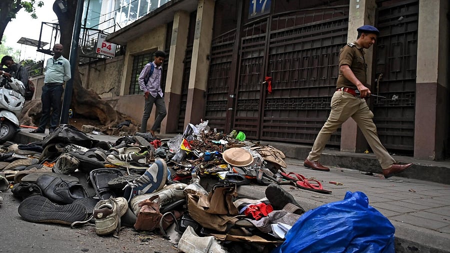 <div class="paragraphs"><p>Remains littered the spot on Thursday where 11 people died in a tragic stampede, as thousands of fans had thronged to enter M Chinnaswamy Stadium in Bengaluru to take part in the celebrations of RCB's win in the Indian Premier League. </p></div>