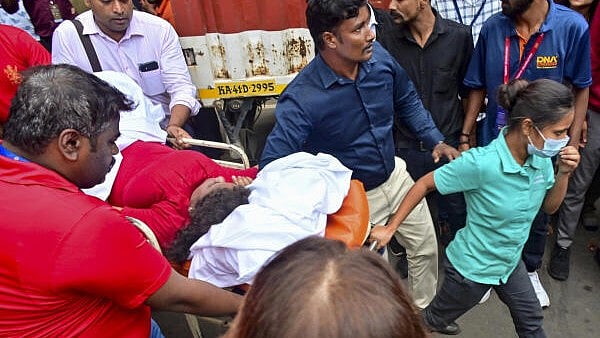 <div class="paragraphs"><p>An injured being taken for treatment following a stampede near the Chinnaswamy Stadium, after a large number of fans gathered for the felicitation of IPL 2025 winning Royal Challengers Bengaluru team, in Bengaluru, Karnataka.</p></div>