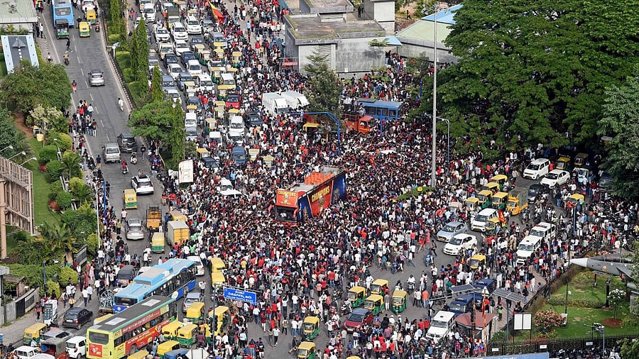 <div class="paragraphs"><p>People gather to celebrate Royal Challengers Bengaluru's first Indian Premier League (IPL) title win, outside a cricket stadium in Bengaluru</p></div>