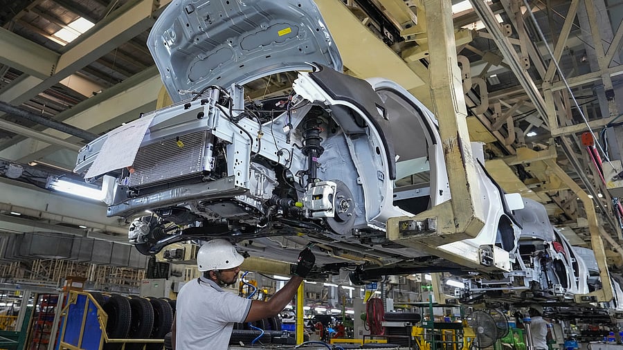 <div class="paragraphs"><p>Employees work in an assembly line at the joint manufacturing facility of Renault-Nissan Automotive India Pvt Ltd, near Chennai</p></div>