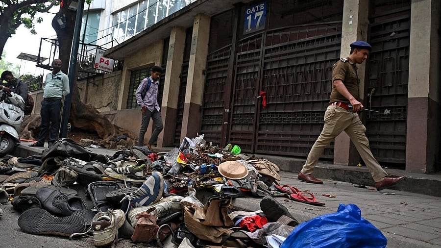 <div class="paragraphs"><p>Remains littered the spot on Thursday where 11 people died in a tragic stampede, as thousands of fans had thronged to enter M Chinnaswamy Stadium in Bengaluru to take part in the celebrations of RCB's win in the Indian Premier League.</p></div>