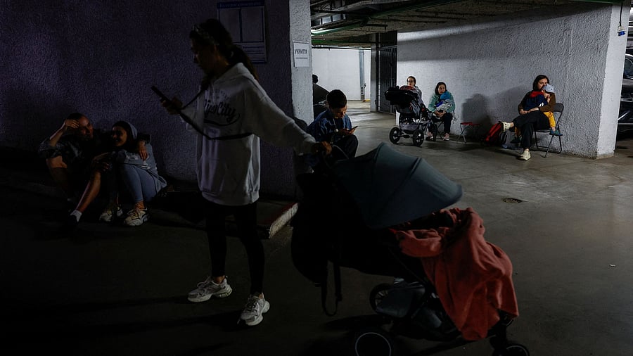 <div class="paragraphs"><p>Residents take shelter inside an underground parking during Russian drone and missile strikes, amid Russia's attack on Ukraine, in Kyiv, Ukraine</p></div>