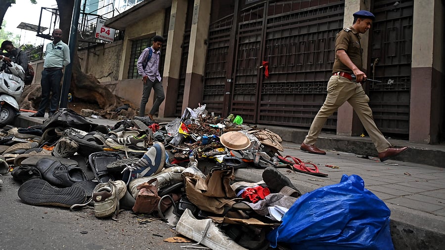 <div class="paragraphs"><p>Remains littered the spot  where 11 people died in a tragic stampede, as thousands of fans had thronged to enter M Chinnaswamy Stadium in Bengaluru to take part in the celebrations of RCB's win in the Indian Premier League. </p></div>