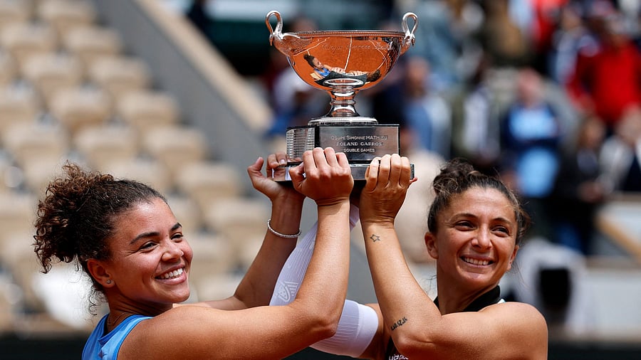 <div class="paragraphs"><p>Italy's Jasmine Paolini and Sara Errani lift a trophy as they celebrate winning their women's doubles final match against Serbia's Aleksandra Krunic and Kazakhstan's Anna Danilina.</p></div>