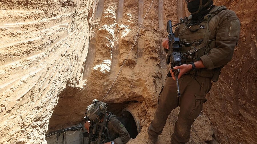 <div class="paragraphs"><p>Israeli soldiers walk out from a tunnel underneath the European Hospital in Khan Younis at the Gaza Strip, amid the ongoing ground operation of the Israeli army against Palestinian Islamist group Hamas, June 8, 2025.</p></div>