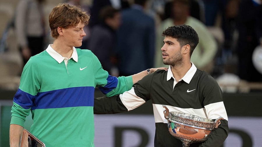<div class="paragraphs"><p>Jannik Sinner of Italy and Carlos Alcaraz of Spain pose together at the trophy presentation after the men’s singles final on day 15 at Roland Garros Stadium.</p></div>