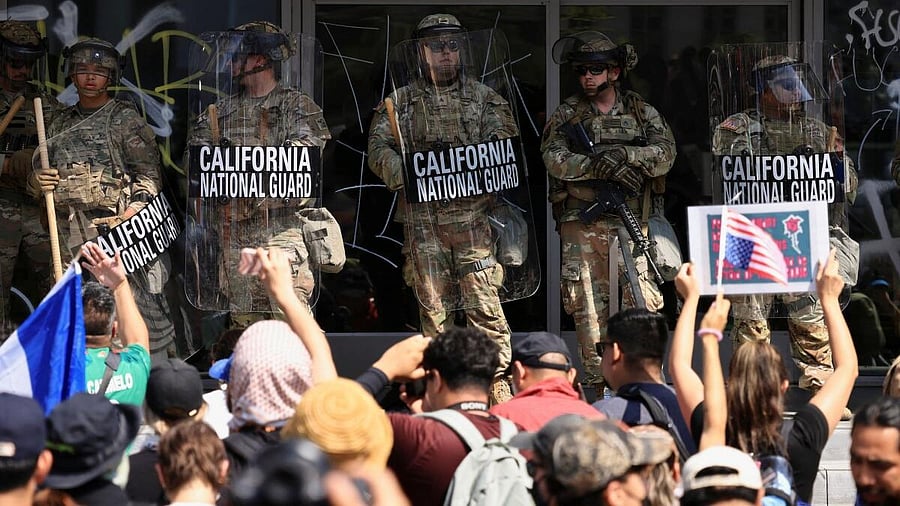<div class="paragraphs"><p>Demonstrators gather as members of the California National Guard stand outside the Edward R. Roybal Federal Building, after their deployment by U.S. President Donald Trump, in response to protests against immigration sweeps, in Los Angeles, California, US June 9, 2025.</p></div>