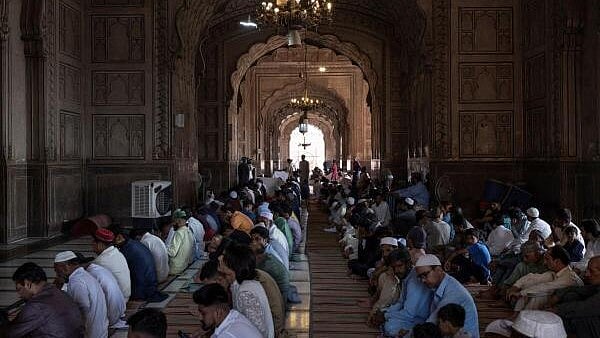 <div class="paragraphs"><p>Worshipers wait for the start of the Eid al-Adha prayer  in Pakistan.</p></div>