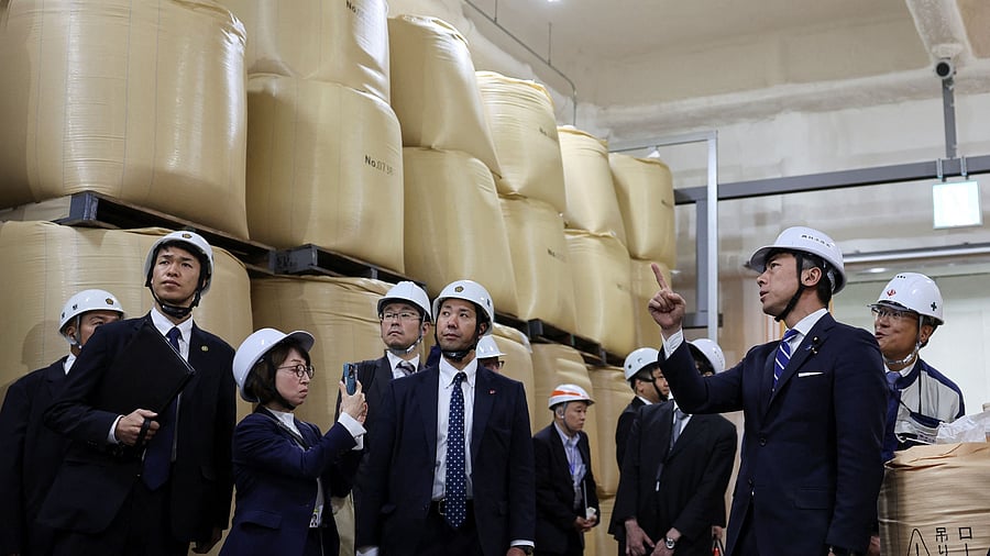 <div class="paragraphs"><p>Japan's Agriculture, Forestry and Fisheries Minister Shinjiro Koizumi inspects a warehouse storing stockpiled rice in Kanagawa, Japan </p></div>