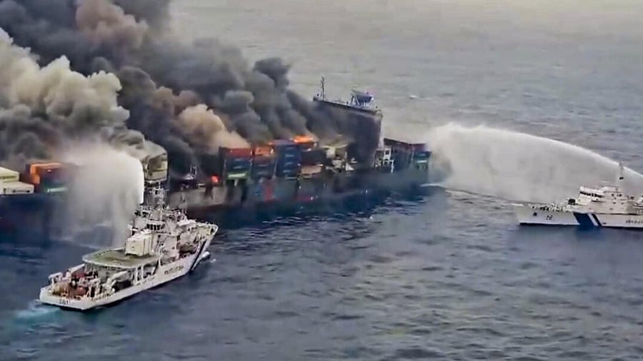 <div class="paragraphs"><p>The Indian Coast Guard ships carry out the firefighting operation after a fire broke out on a Singapore-flagged ship following a container explosion off the Kerala coast, Tuesday, June 10, 2025.</p></div>