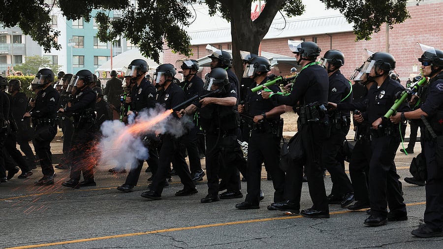 <div class="paragraphs"><p>A police officer fires a crowd control munition, during protests against federal immigration sweeps, in Los Angeles, California, June 9, 2025.</p></div>