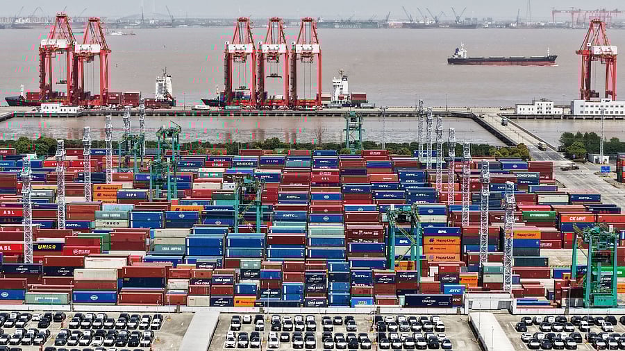 <div class="paragraphs"><p>A drone view shows electric vehicles  for export and containers sitting at a port in Shanghai, China April 13, 2025. </p></div>