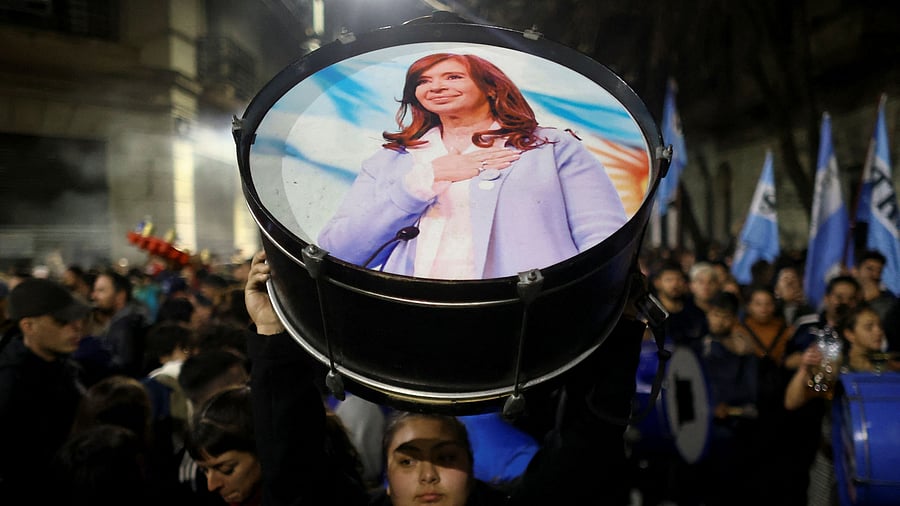 <div class="paragraphs"><p>A supporter holds up a percussion instrument with an image of former President Cristina Fernandez de Kirchner outside her house after Argentina's Supreme Court upheld her guilty verdict for defrauding the state, in Buenos Aires, Argentina, June 10, 2025. </p></div>