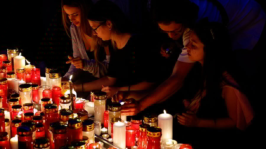 <div class="paragraphs"><p>People light candles in the main square following a deadly school shooting in Graz, Austria, June 10, 2025. </p></div>