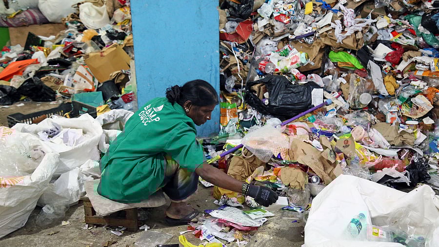 <div class="paragraphs"><p>A BBMP worker segregates waste at a dry waste segregation unit in Jayanagar.&nbsp;</p></div>