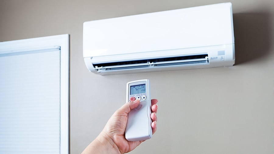 <div class="paragraphs"><p>A person operation an air conditioner with a remote. Image for representation.</p></div>