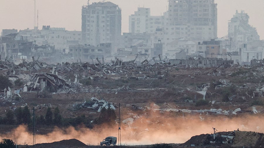 <div class="paragraphs"><p>A military vehicle manoeuvres in Gaza, as seen from the Israeli side of the border</p></div>