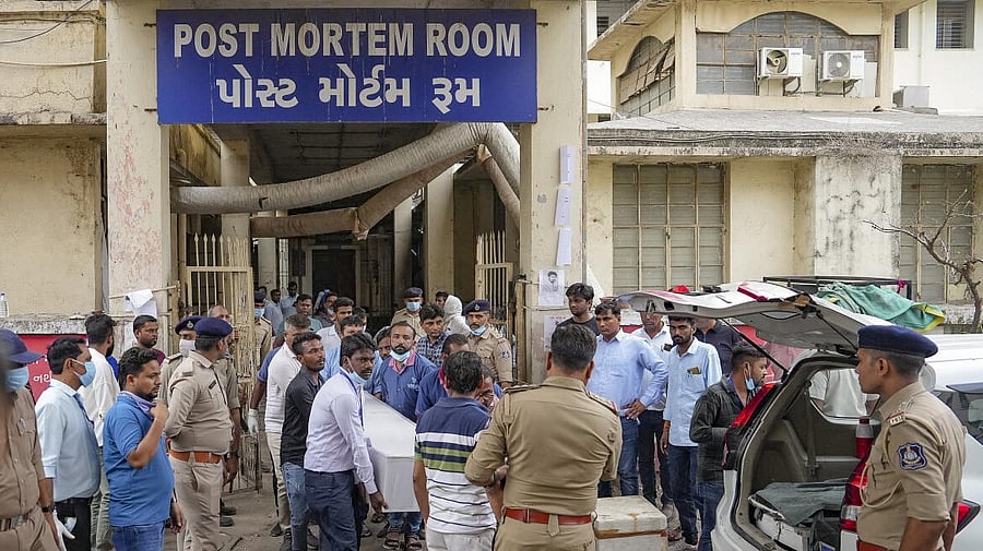 <div class="paragraphs"><p>Medics carry mortal remains of a victim of the Air India plane at a hospital, in Ahmedabad</p></div>