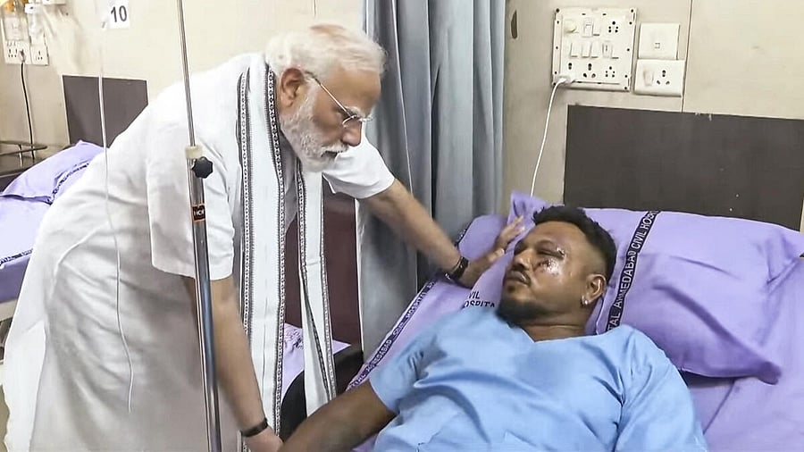 <div class="paragraphs"><p>Prime Minister Narendra Modi meets Vishwash Kumar Ramesh, the lone survivor of yesterday's Air India plane crash, at a hospital, in Ahmedabad.</p></div>