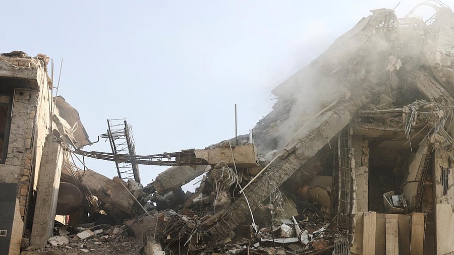 <div class="paragraphs"><p>Smoke rises from a damaged building in the aftermath of Israeli strikes, in Tehran, Iran.</p></div>