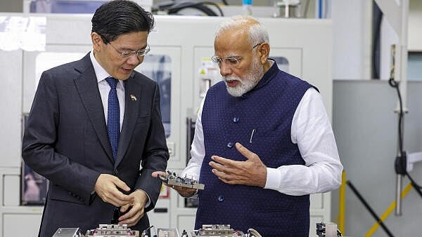 <div class="paragraphs"><p>Prime Minister Narendra Modi with his Singapore counterpart Lawrence Wong during their visit to AEM Holdings Ltd., in Singapore.</p></div>