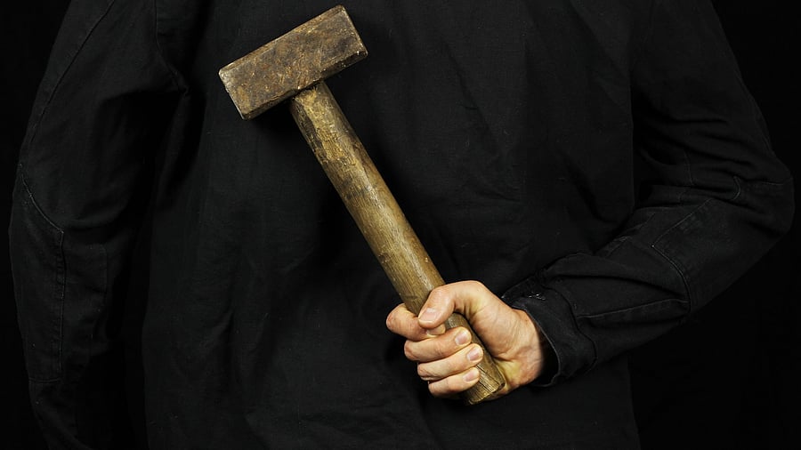 <div class="paragraphs"><p>Image for representation showing a man holding a hammer.</p></div>