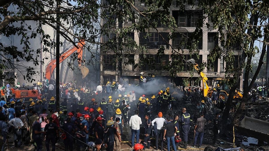 <div class="paragraphs"><p>Rescue team members work at the site where an Air India Boeing 787 Dreamliner plane crashed in Ahmedabad.</p></div>