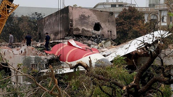 <div class="paragraphs"><p>Members of Indian Army's engineering arm prepare to remove the wreckage of an Air India aircraft, bound for London's Gatwick Airport, which crashed during take-off from an airport in Ahmedabad, India.</p></div>