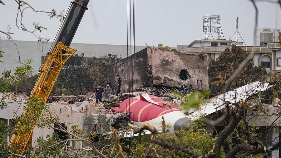 <div class="paragraphs"><p>Cranes being used to clear the debris of the crashed Air India plane, in Ahmedabad, Saturday, June 14, 2025.</p></div>
