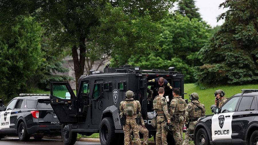 <div class="paragraphs"><p>Officers are posted in a staging area after what police said was a targeted shooting in the area around Edinburgh Golf Course in the Minneapolis suburb of Brooklyn Park, Minnesota, US</p></div>