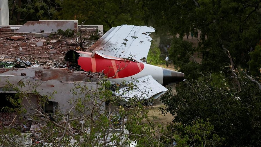 <div class="paragraphs"><p>A tail of an Air India Boeing 787 Dreamliner plane that crashed is seen stuck on a building after the incident in Ahmedabad, India, June 12, 2025.</p></div>