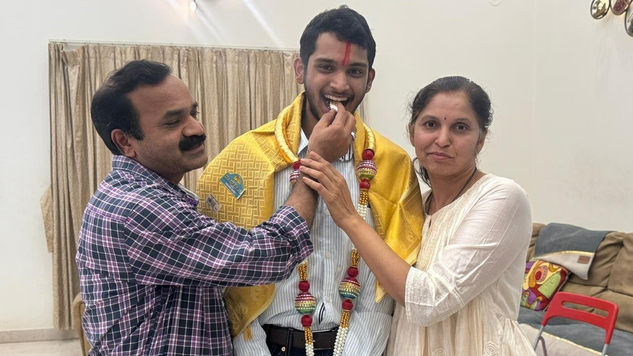 Parents offer sweet to Nikhil Sonnad, who secured All India Rank 17 and emerged the state topper in NEET 2025, in Vijayapura on Saturday. Nikhil is a student of Excellent PU College, Mangaluru.