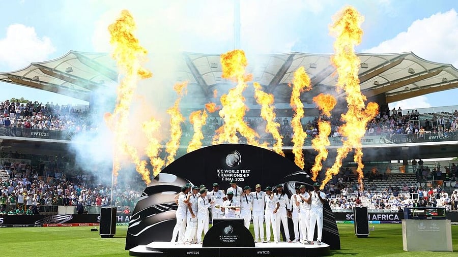 <div class="paragraphs"><p>South Africa's Temba Bavuma lifts the ICC Test Championship Mace on the podium with teammates after winning the final</p></div>